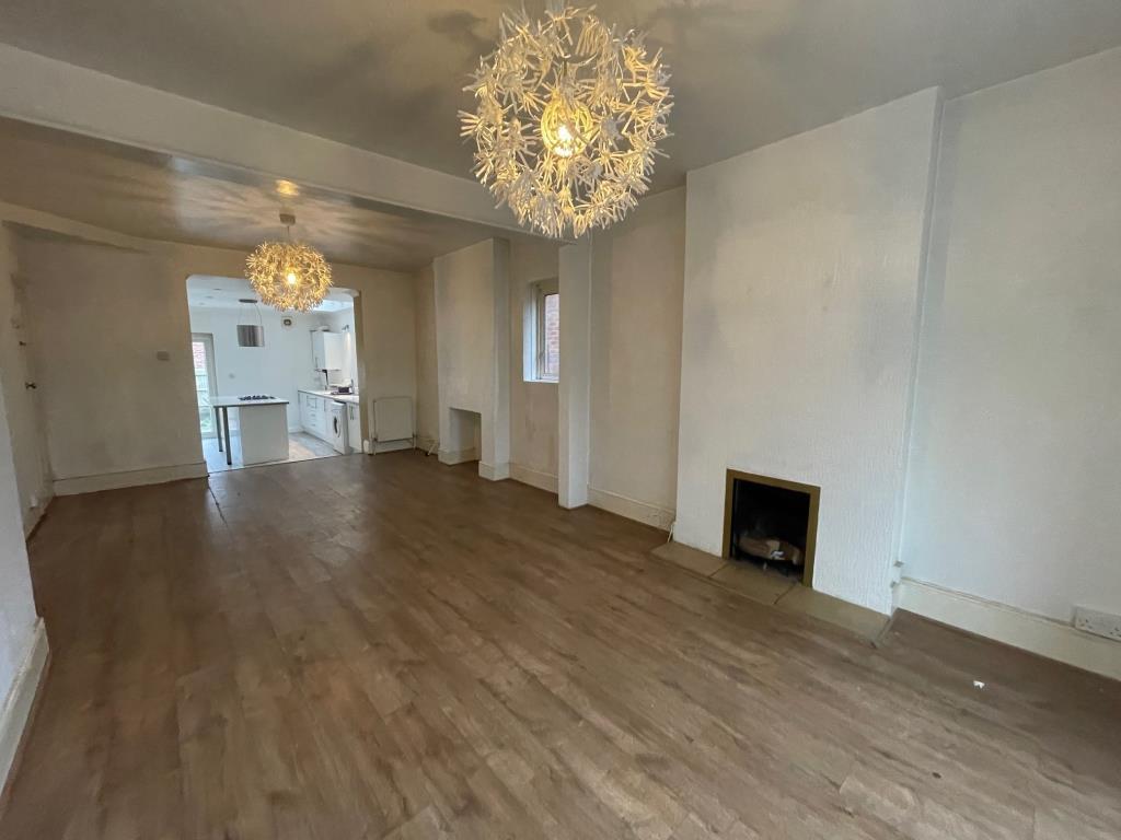 Lot: 3 - THREE-BEDROOM HOUSE IN POPULAR LOCATION - Living room from bay window looking toward the kitchen